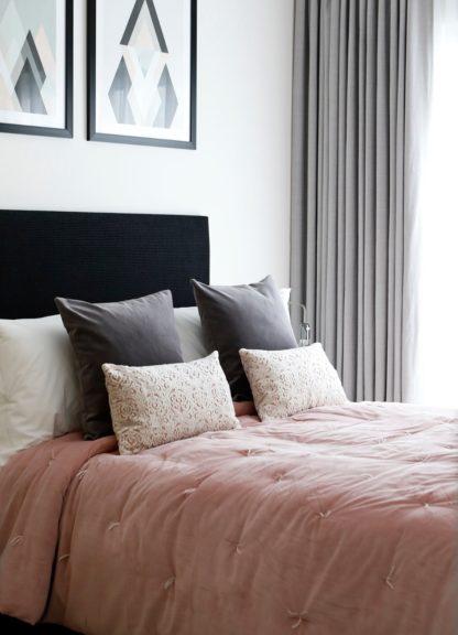 Staged living room with soft furnishings and curtains